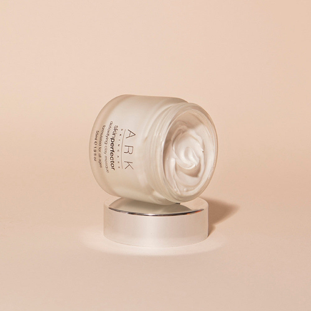 Model using ARK Skincare's Detoxifying Clay Masque. Luxurious dual clay formula. Cruelty free & 100% vegan