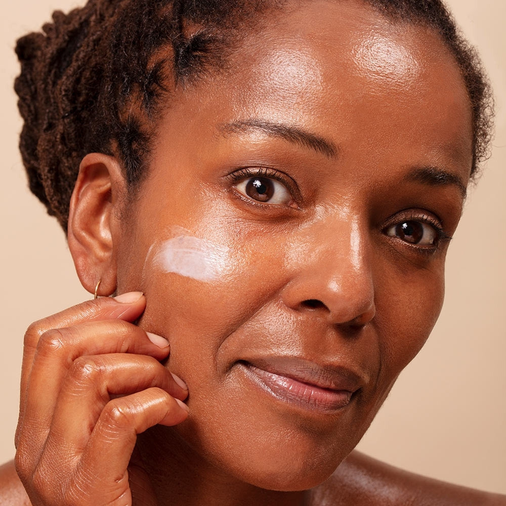 Model wearing ARK's Defy Nourishing Moisturiser showing how the cream plumps & leaves mature skin hydrated