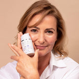 50 plus model with ARK's Defy Night Treatment showing how it leaves skin looking rested, healthy and hydrated
