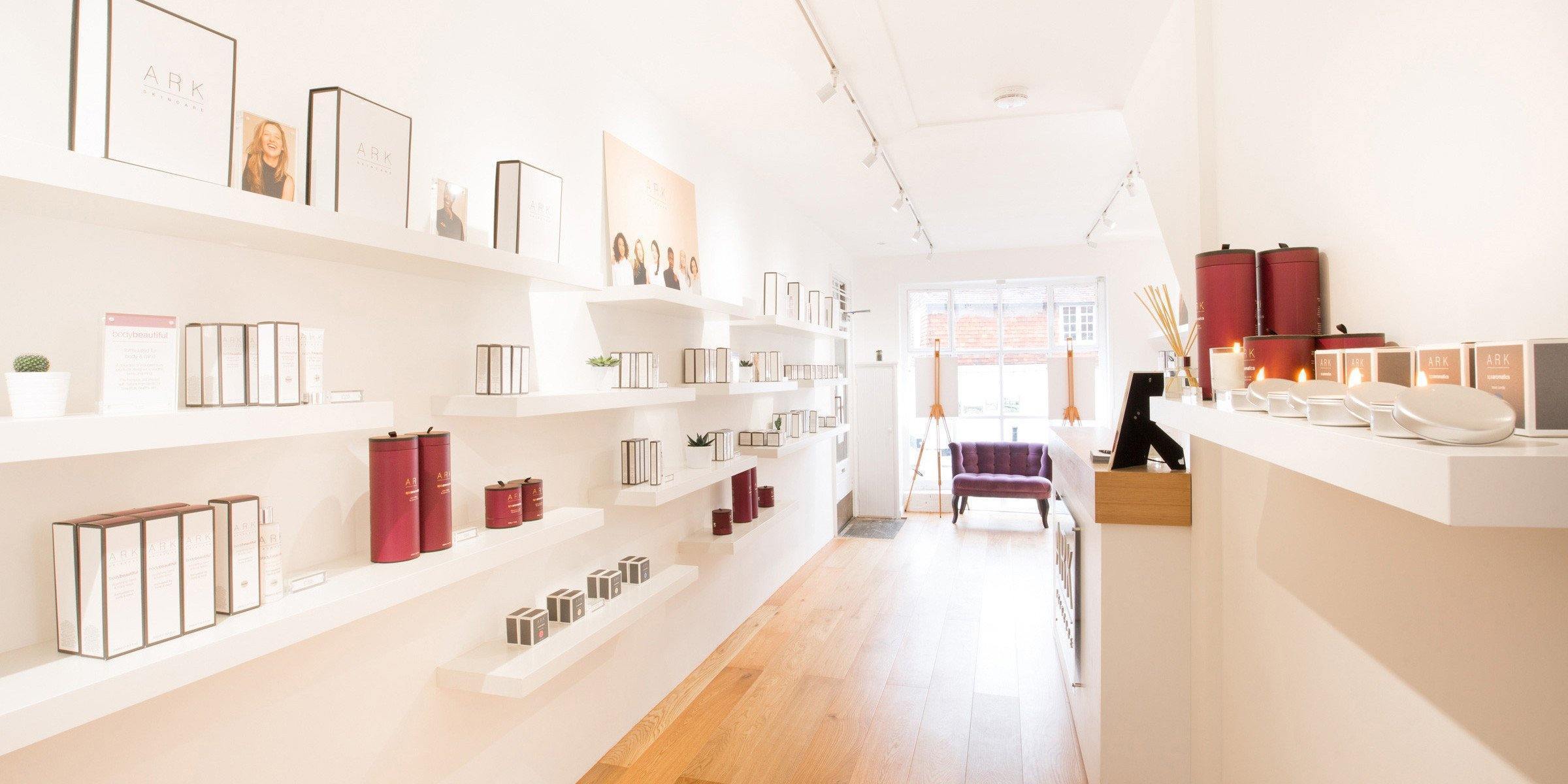 Natural lighting pouring into the interior of the ARK Skincare Boutique, with various products lined up on shelves